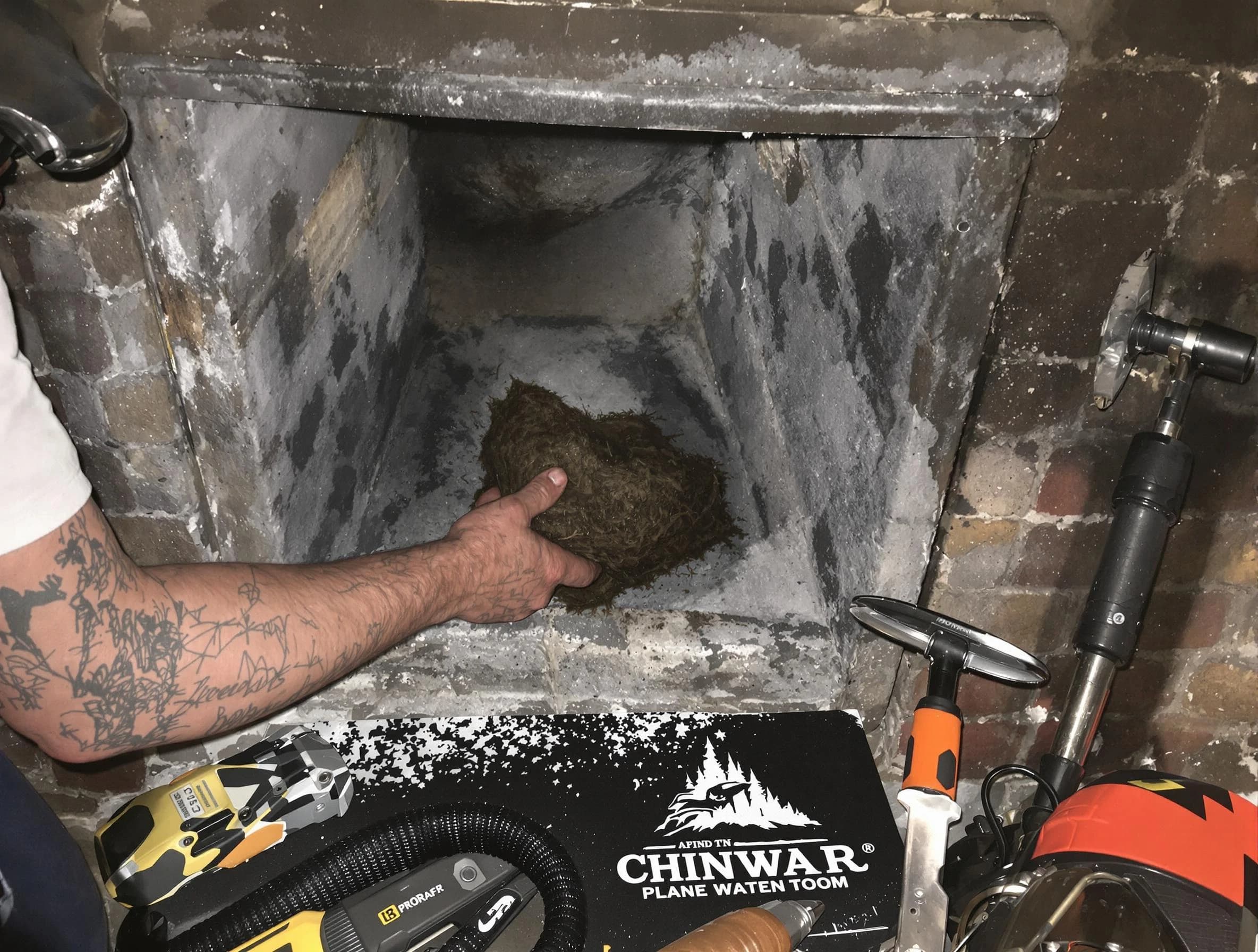 Johnston Chimney Sweep safely removing debris and screening chimney in Johnston, RI